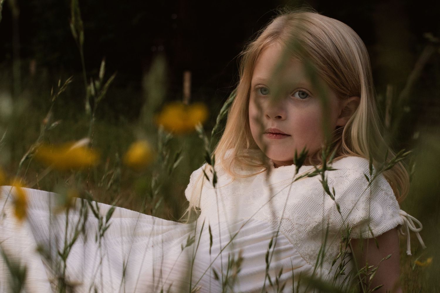 A peaceful portrait sequence in a field of white wildflowers.