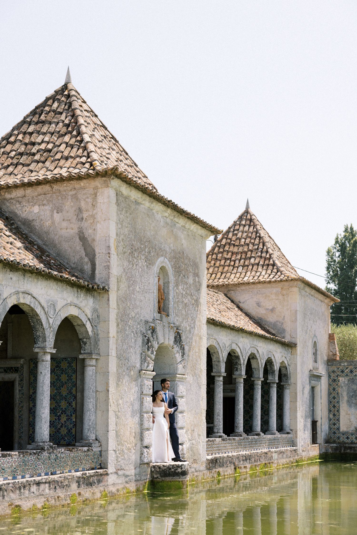 Romantic wedding couple portrait by the lake at Palácio da Bacalhôa Portugal