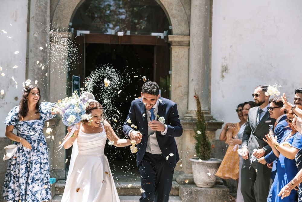 Romantic ceremony exit at historic Portuguese historic church wedding in Portugal