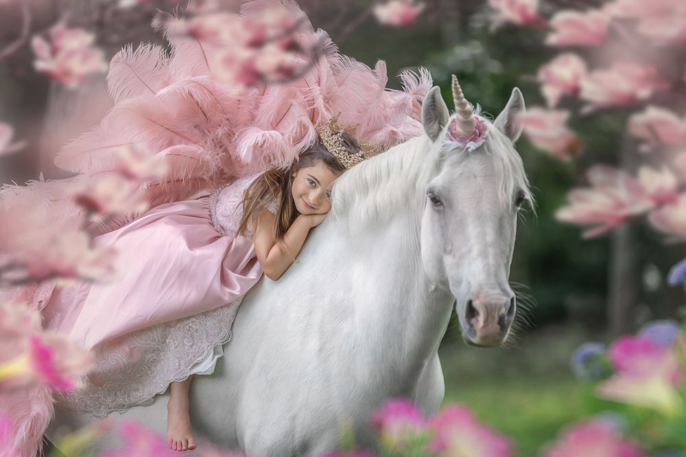 A dreamy pink and white floral scene with delicate cherry blossoms and soft bokeh effect in the background.