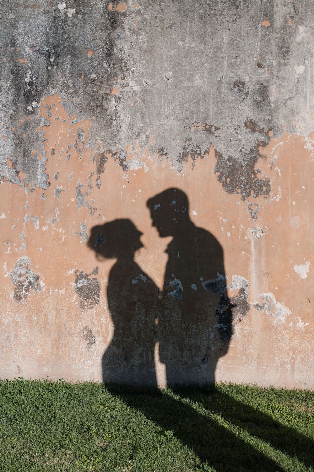Silhouette shadows of couple on textured wall in Old San Juan Puerto Rico