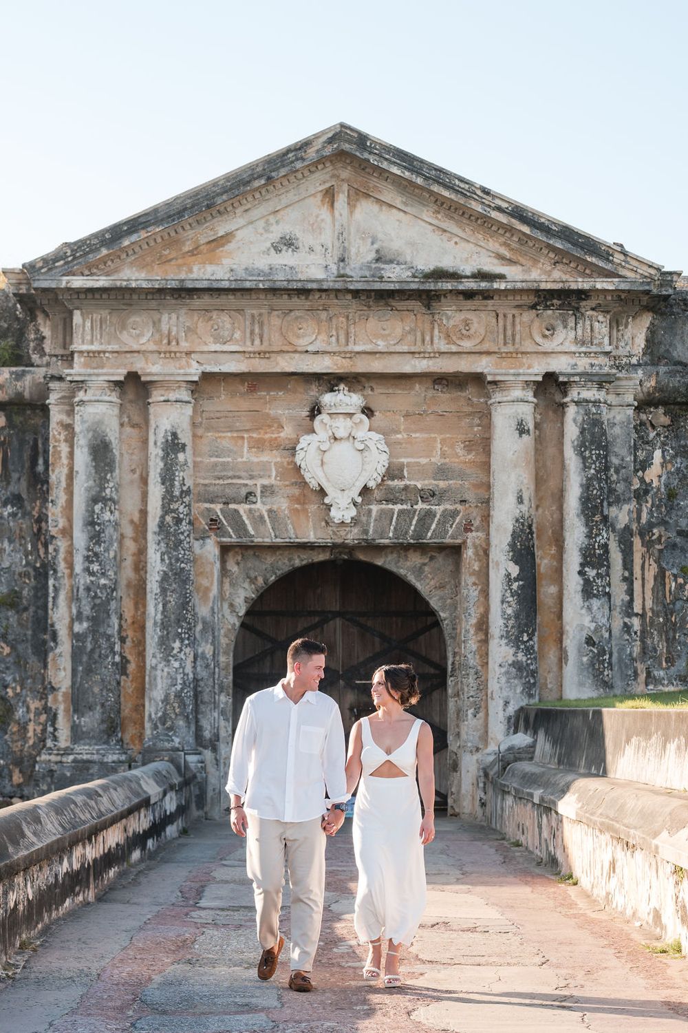 Couple standing in front of historic stone building in Old San Juan Puerto Rico