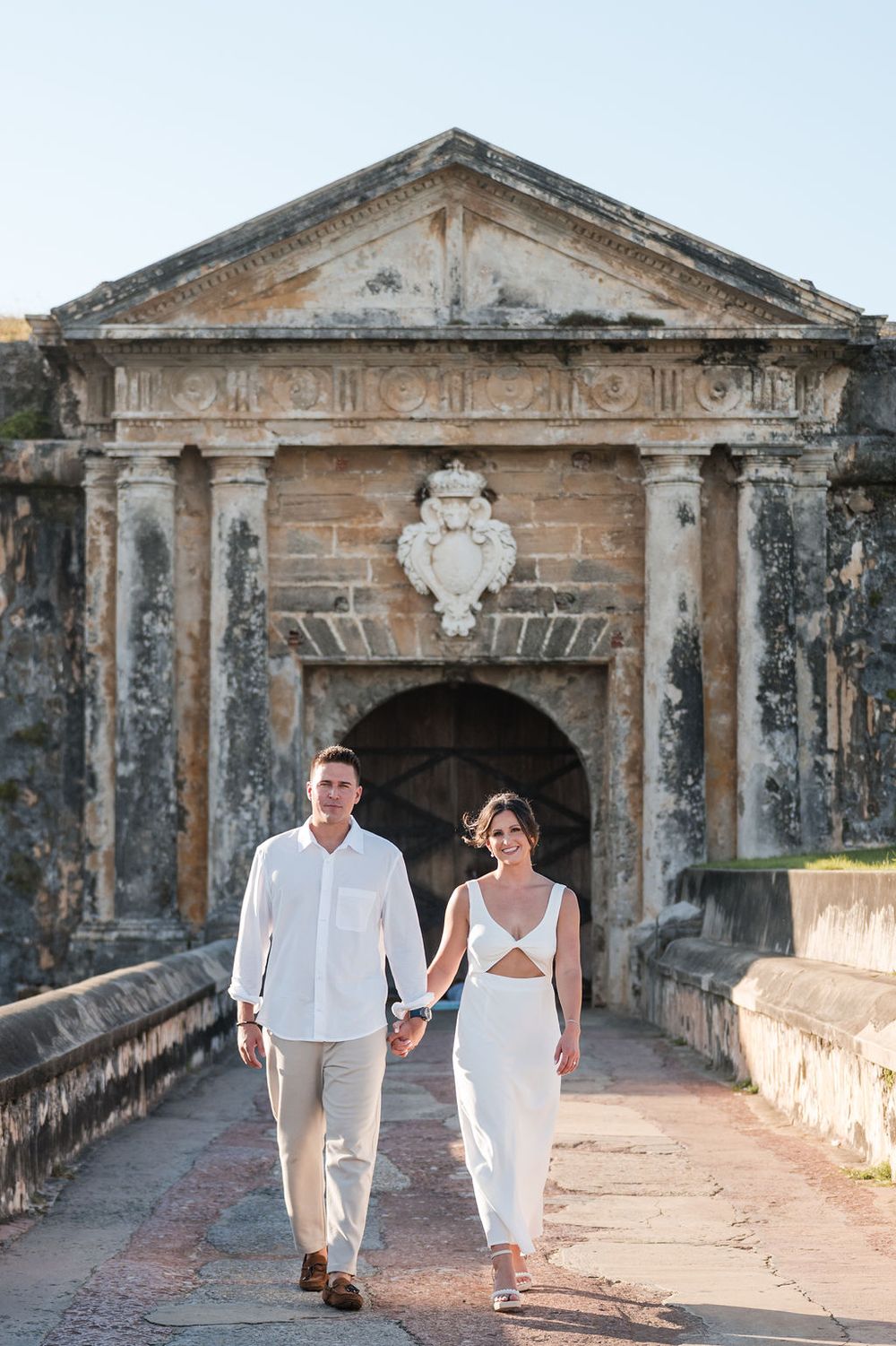 Couple standing in front of historic stone building in Old San Juan Puerto Rico