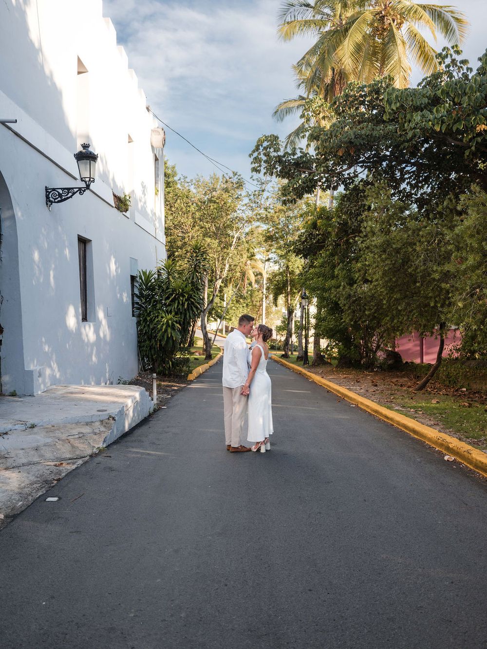 Bride walking through colorful street in Old San Juan Puerto Rico engagement session