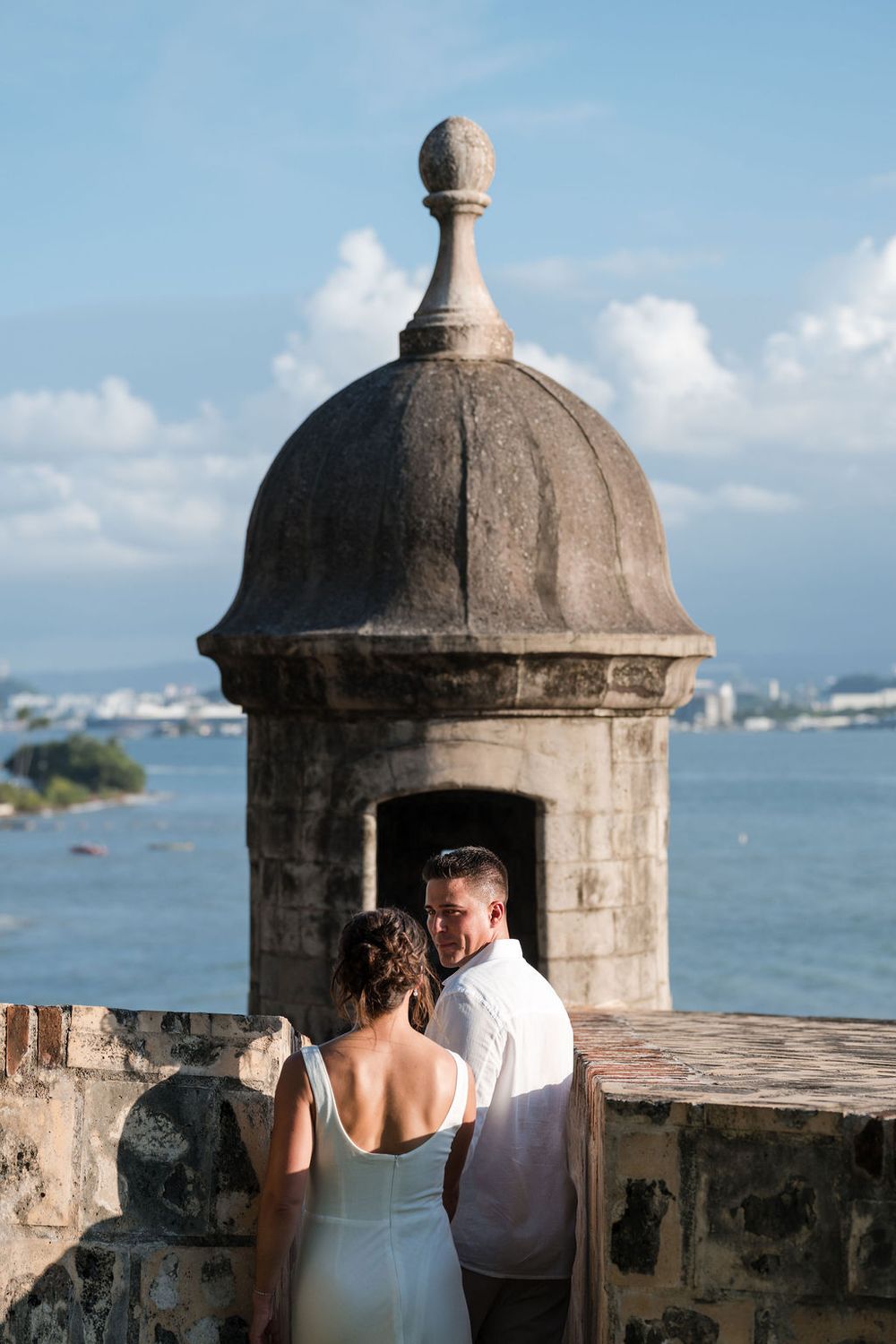 Couple posing near historic dome architecture in Old San Juan Puerto Rico