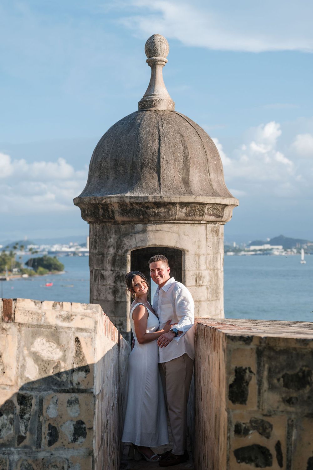 Couple embracing near historic dome in Old San Juan Puerto Rico engagement session