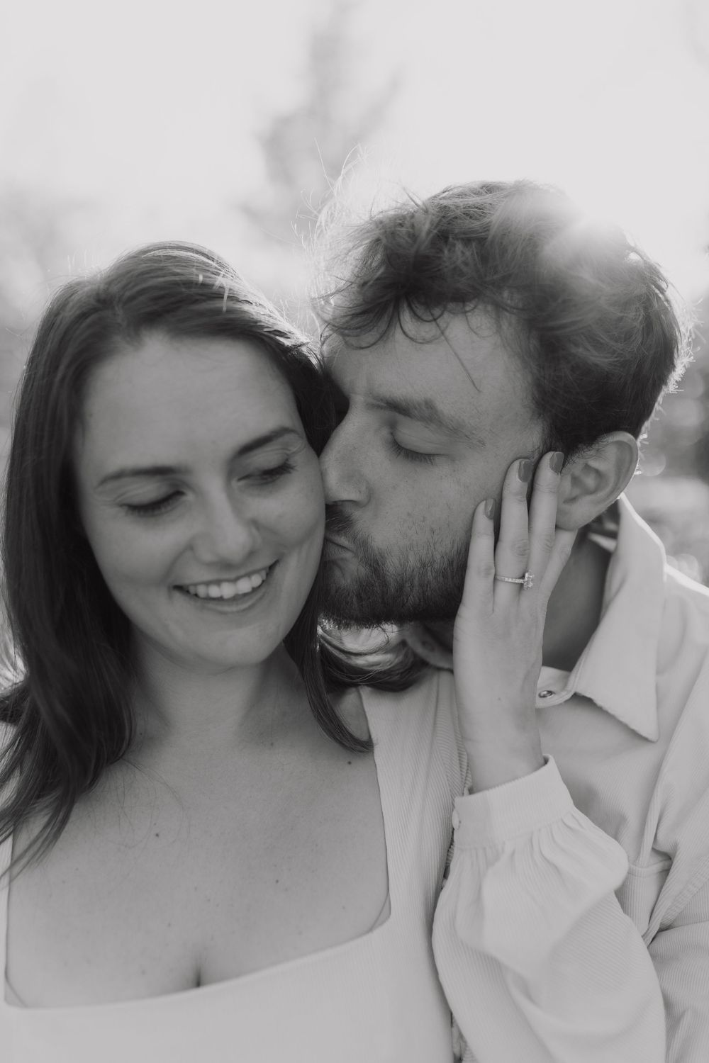 Black and white romantic photo series showing tender intimate moments between a couple.