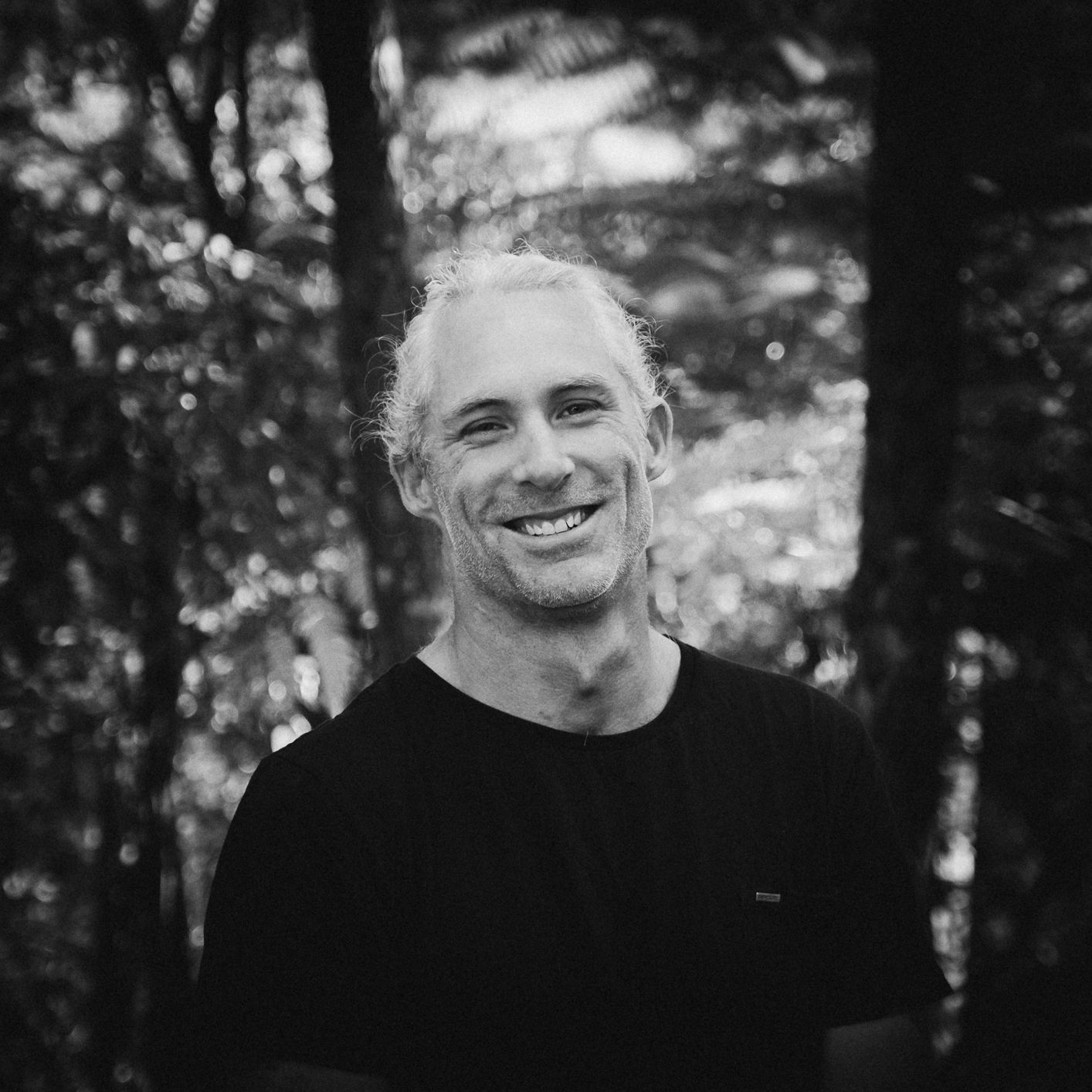 Black and white portrait series showing expressions of joy and laughter.
