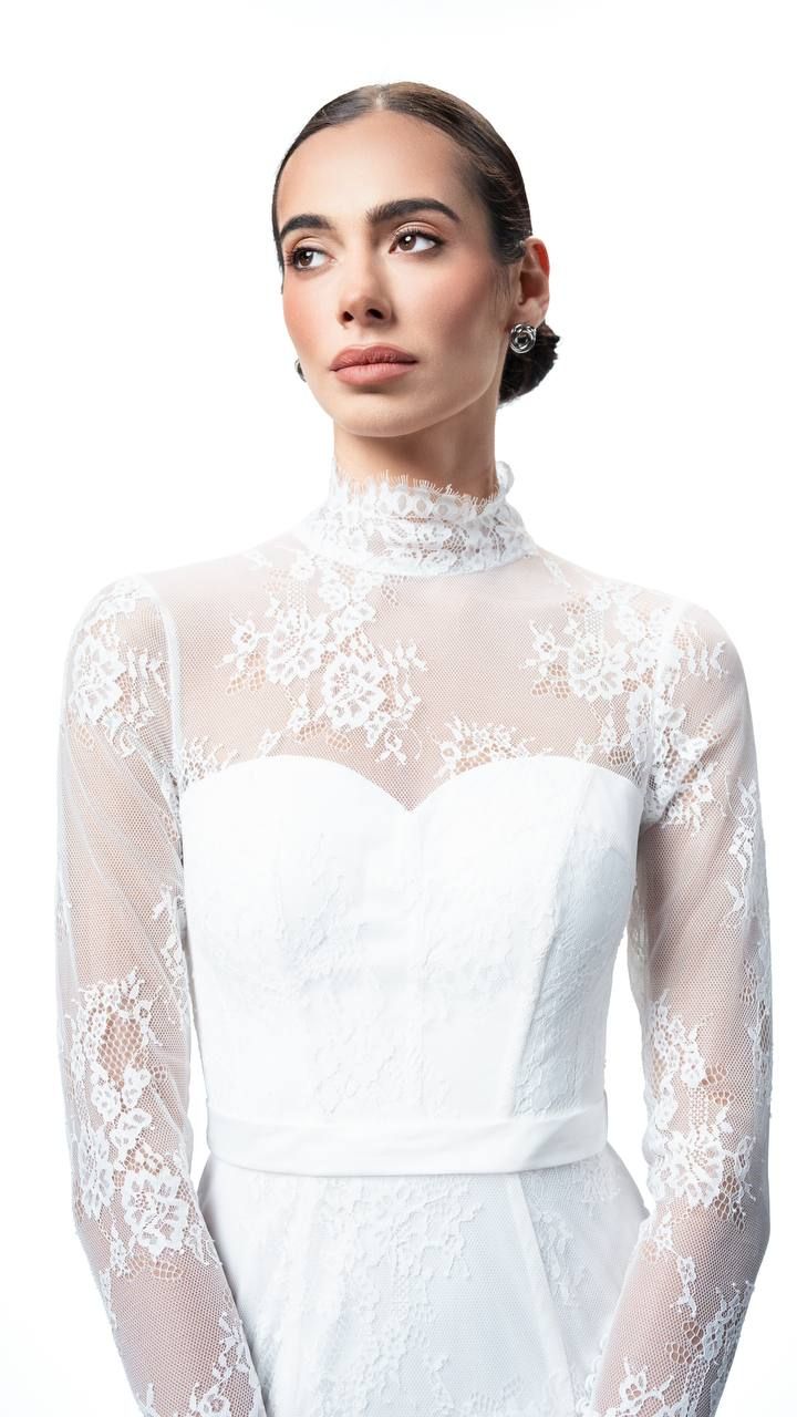 Bridal look featuring soft eyeshadow, flawless skin, and a classic bun created by Cambridge-based makeup artist Vosophie Makeup.