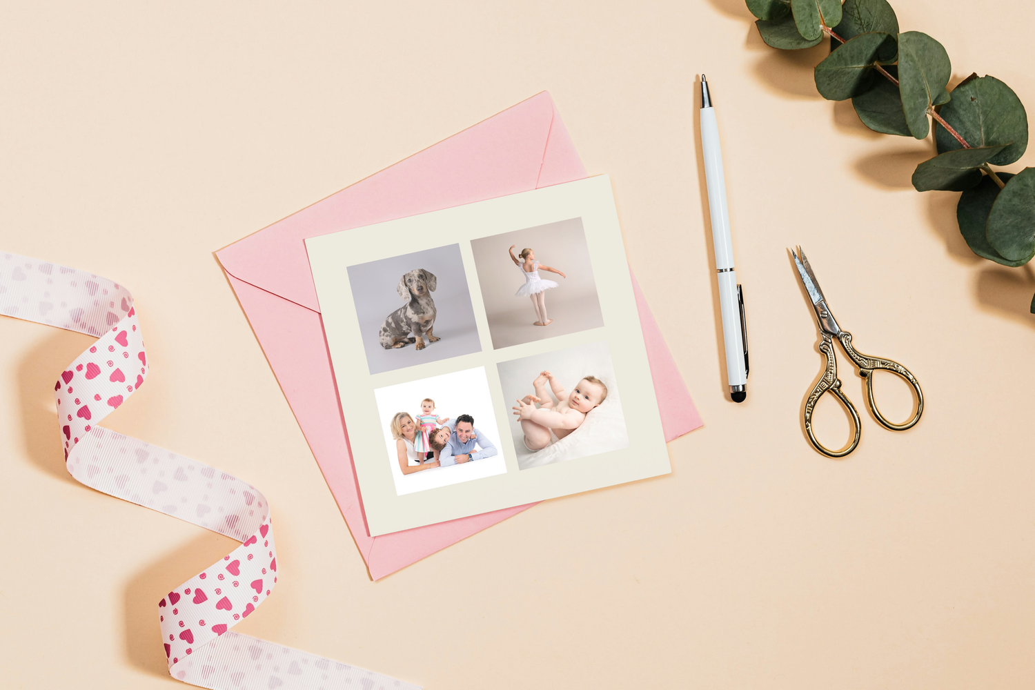 Elegant wedding rings and delicate floral decorations arranged on white paper with soft natural lighting.