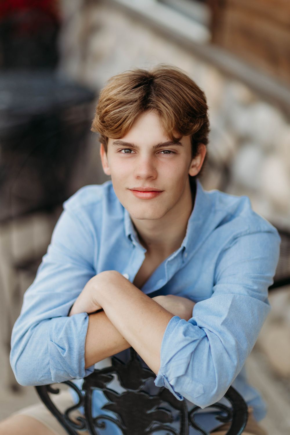 Casual portrait of someone in a light blue button-down shirt.