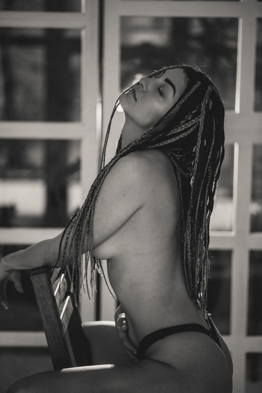 Artistic black and white profile shots showing braided hair.