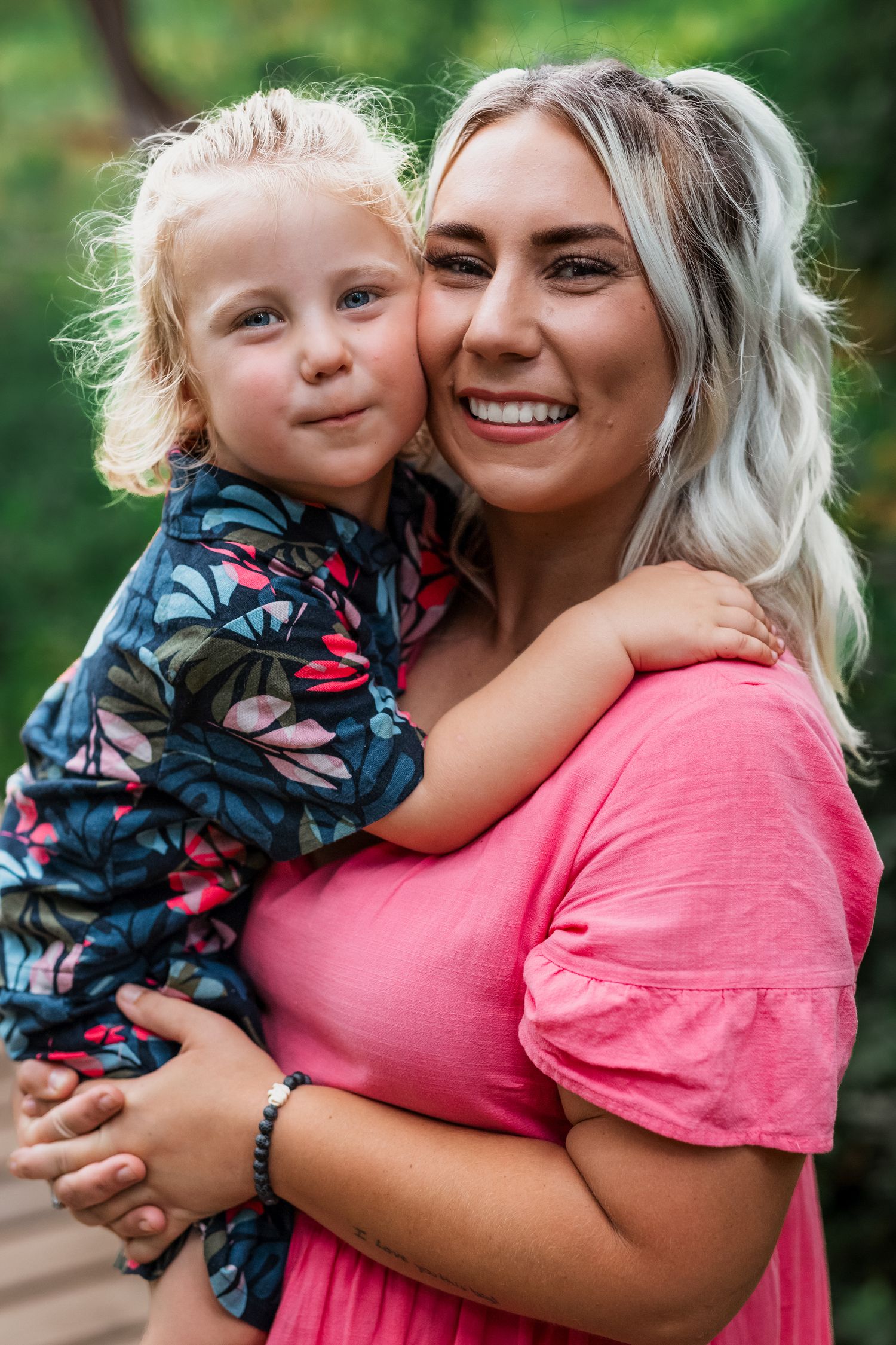Outdoor family portrait in Amherstburg park during golden hour, photographed by a Windsor-based professional.