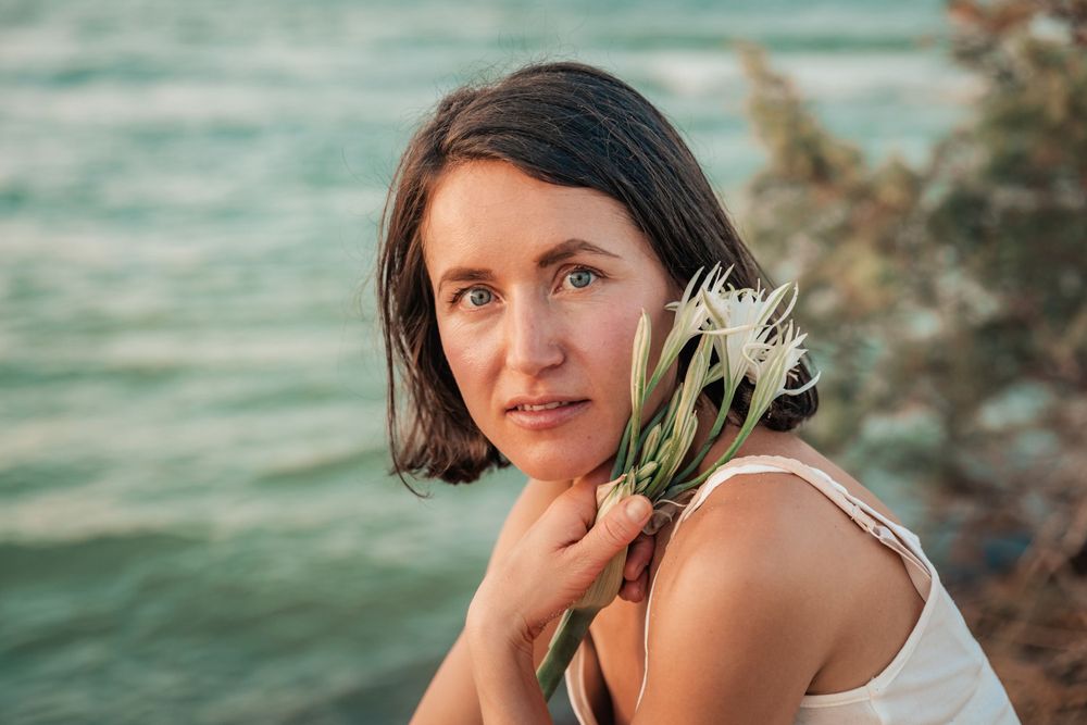 natural cosmetics branding portrait session sunset Mallorca at sea.