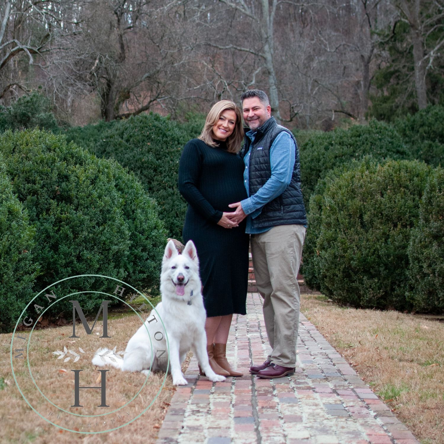 Couple standing with puppy at Morven Park