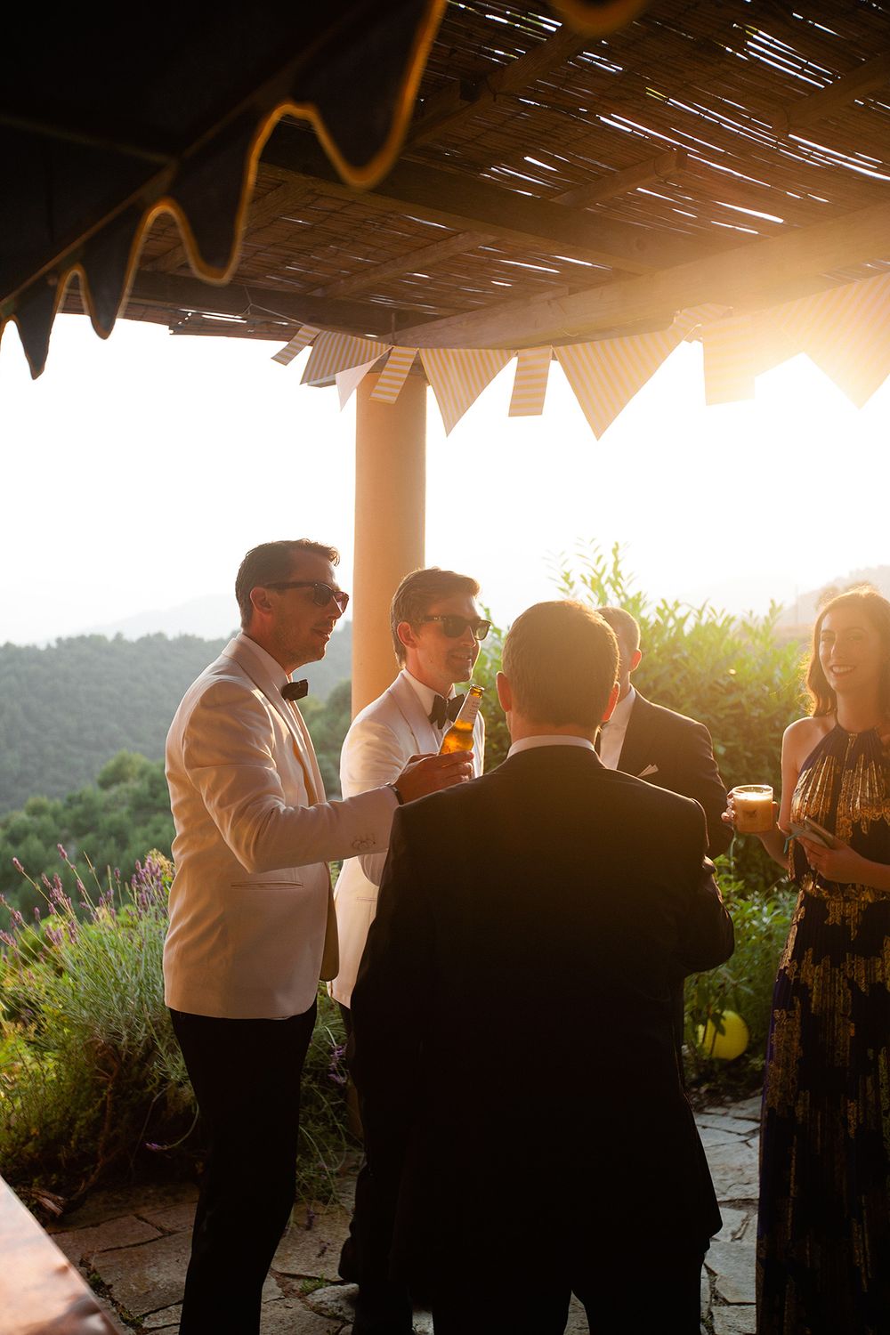 Guests enjoying cocktails at a villa wedding reception in Ventimiglia