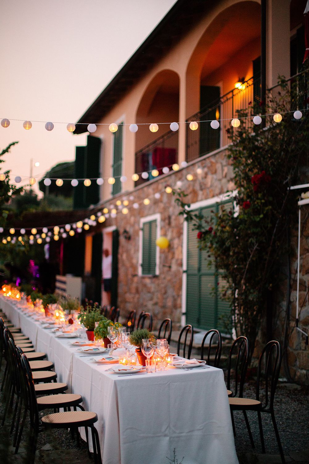Outdoor wedding dinner at a private villa in the hills of Ventimiglia on the Italian Riviera