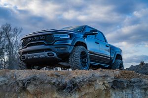 Black Dodge Ram TRX pickup truck on rocky terrain against cloudy sky in Ladson, SC