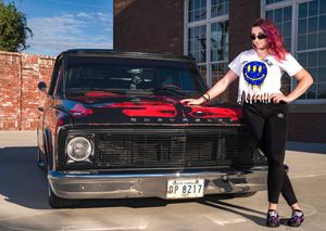 Model posing in front of a vintage pickup truck in North Charleston, SC
