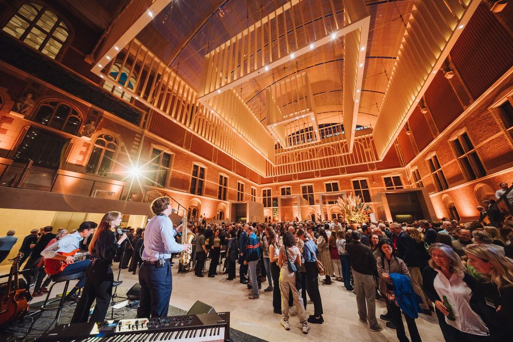 Multiple views of a grand ballroom venue with warm amber lighting and wooden floors showcasing different event setups.
