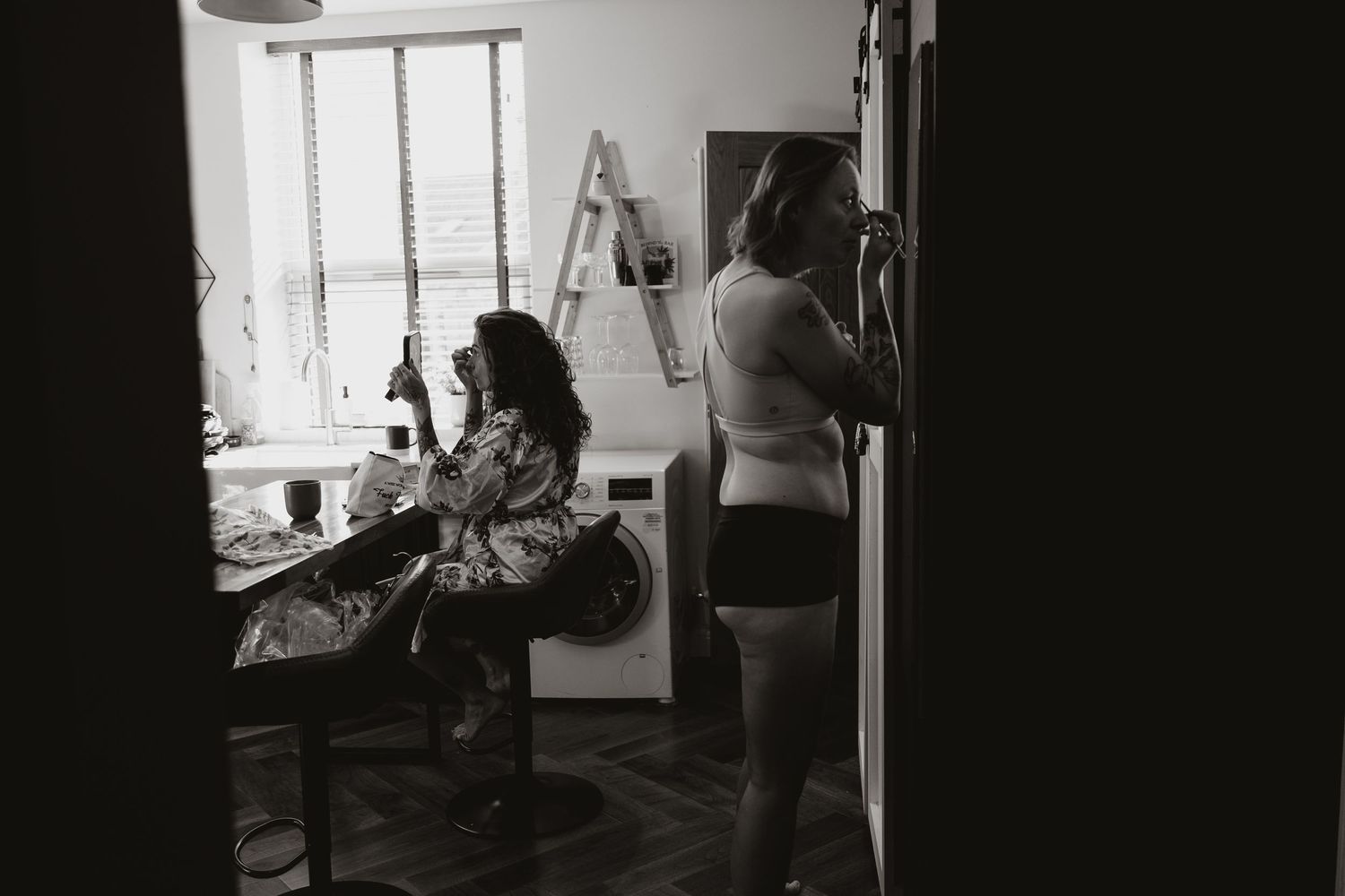 A couple getting ready the morning of their wedding.