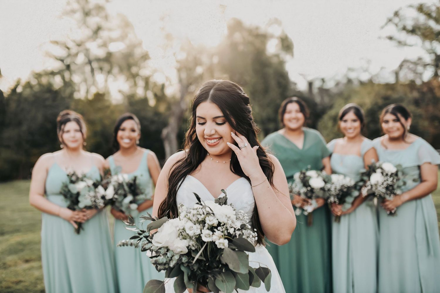 Natural light bridesmaid portraits against trees and sunset