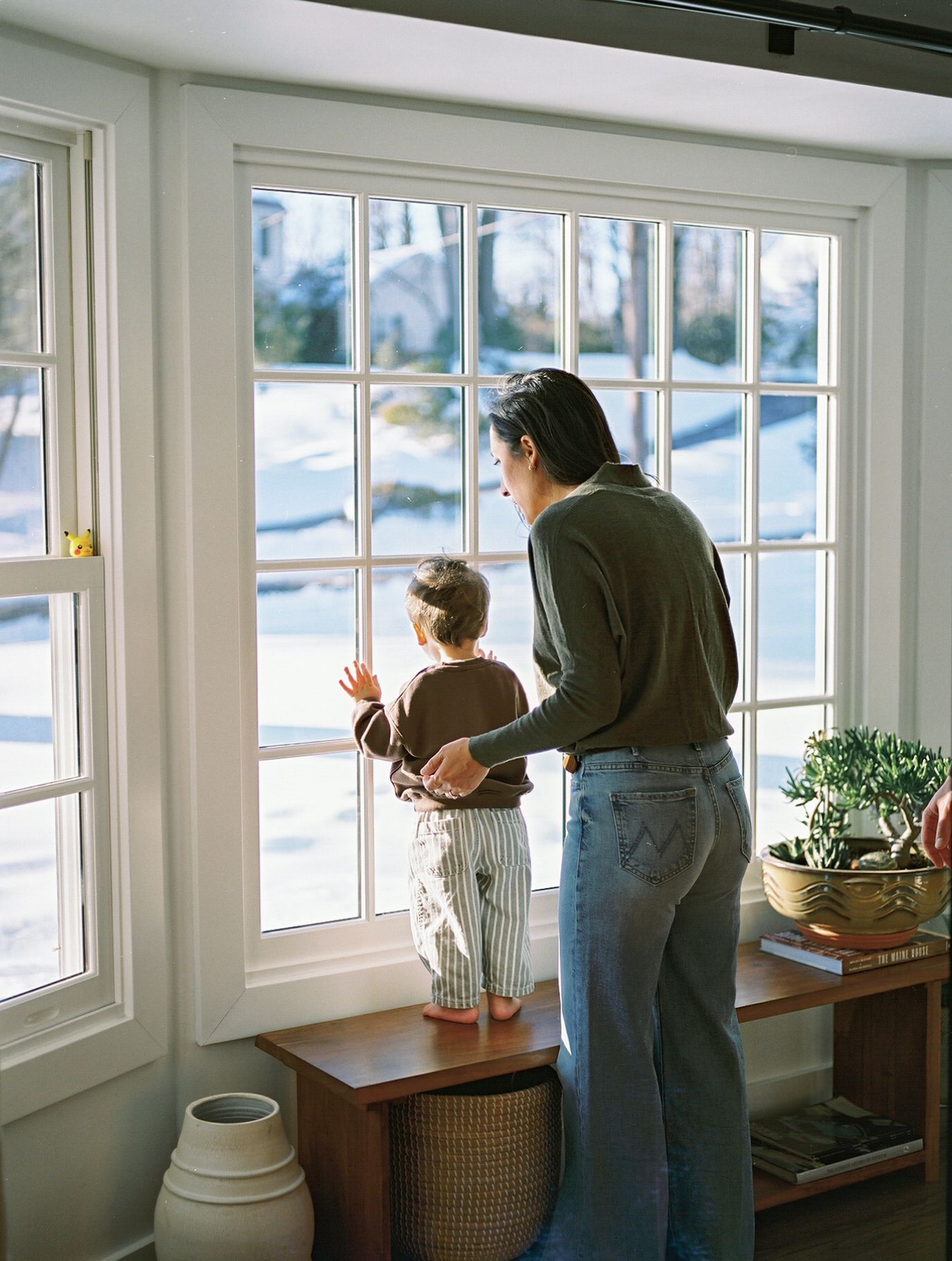 Lifestyle family portrait session captured on film in a bright, airy New Jersey home.