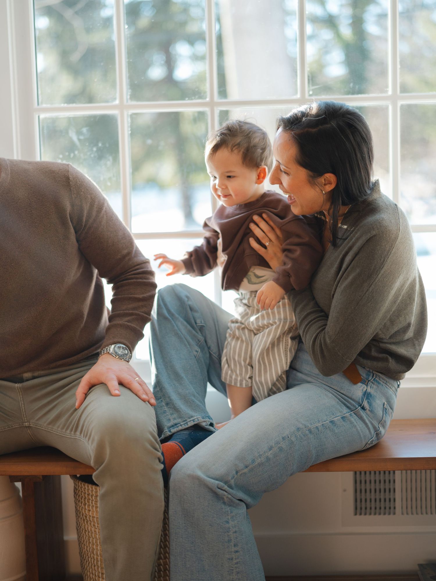 Mother snuggling with toddler son in-home lifestyle photography session in Monmouth County.