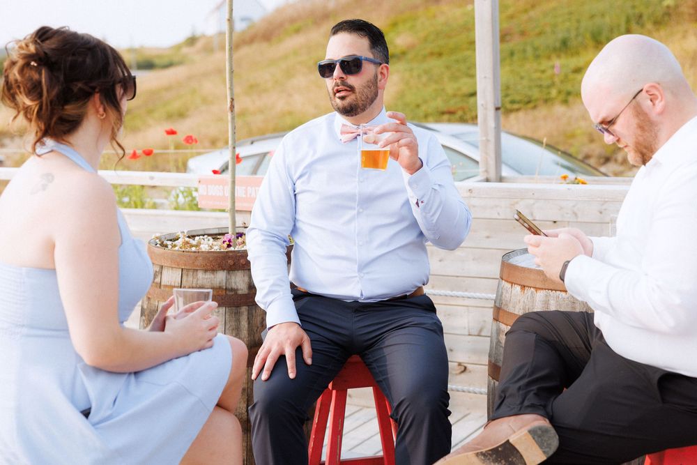 Candid reception photos at Port Rexton Brewery by Newfoundland documentary style wedding photographer Kaitlyn Yvette