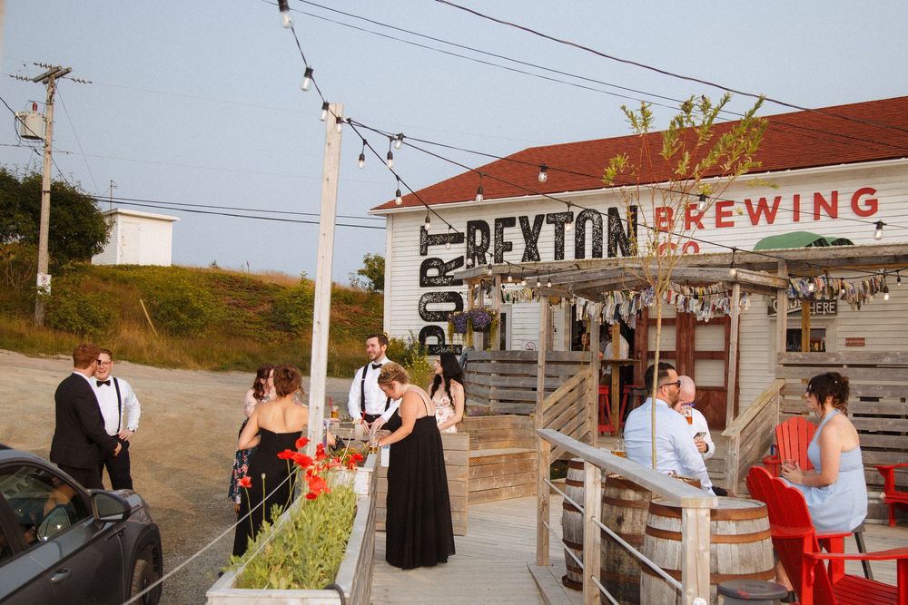 Candid reception photos at Port Rexton Brewery by Newfoundland documentary style wedding photographer Kaitlyn Yvette