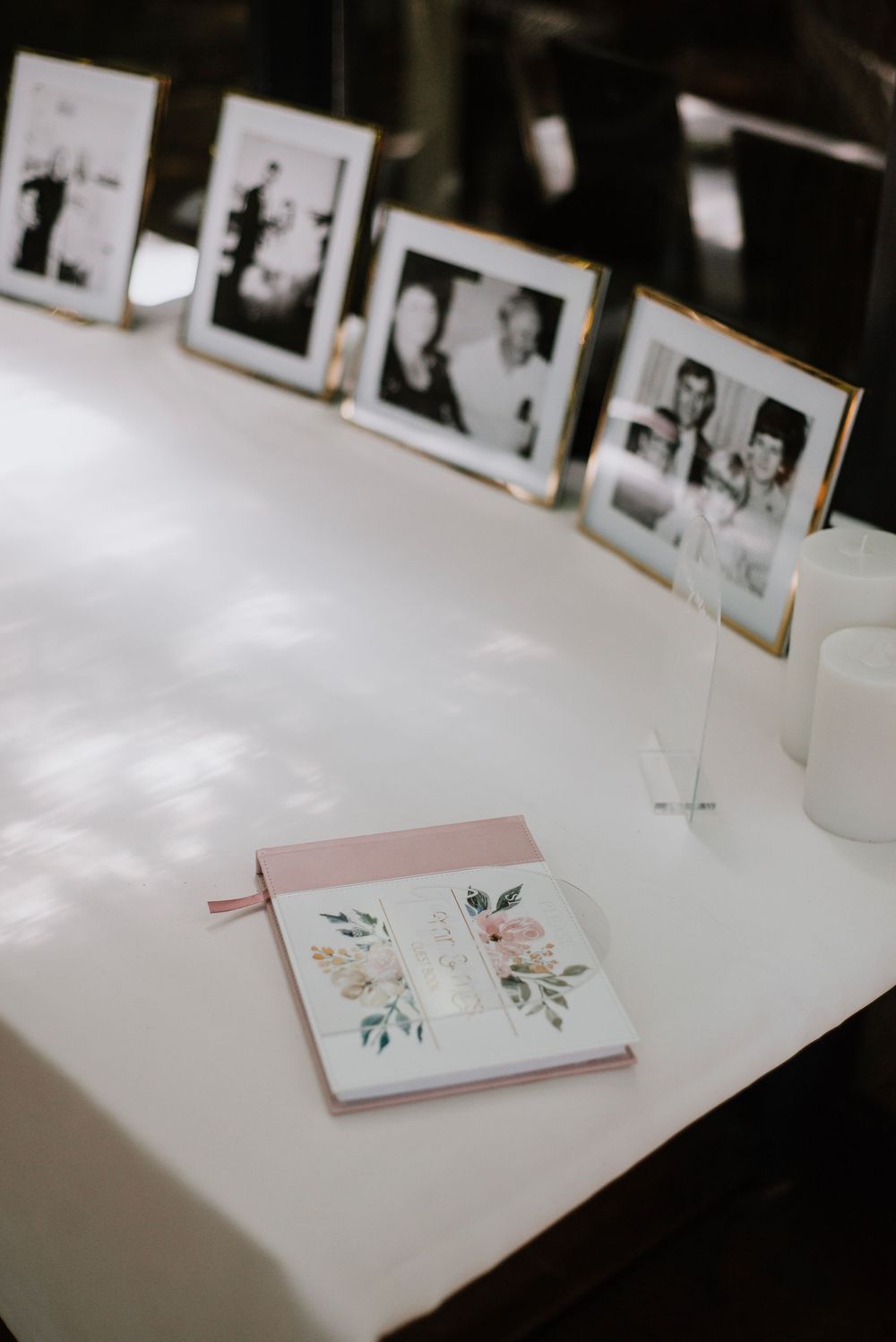 Detail shot of black and white photos featuring parents and grandparents, capturing family heritage and timeless memories