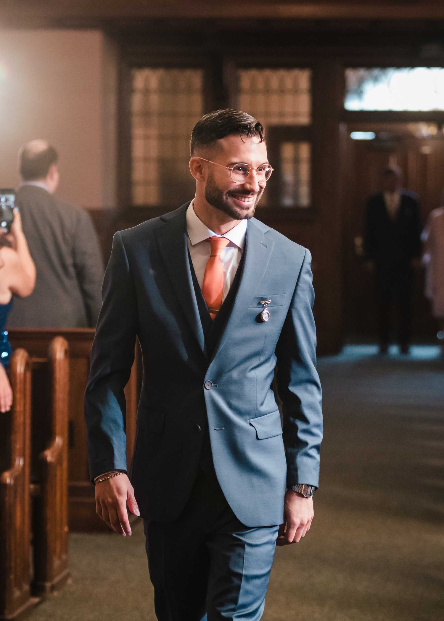 Groom walking down the aisle inside Saint Brigid Church during a South Boston wedding ceremony