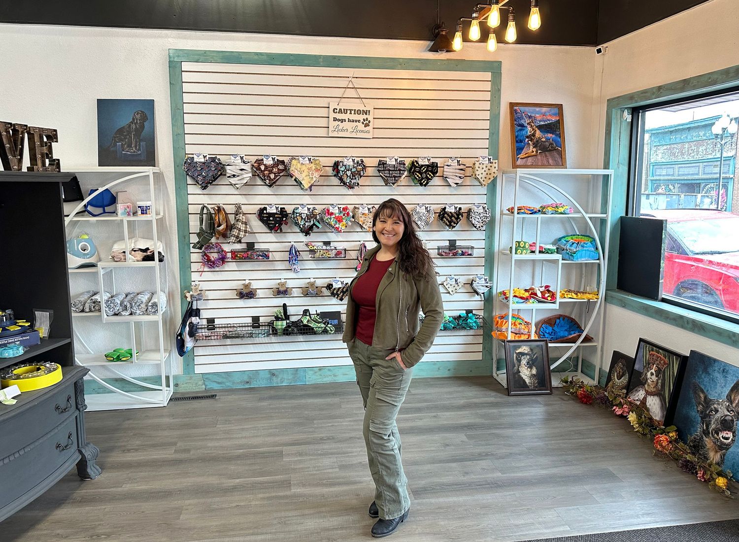 Interior view of a pet boutique store with shelving displays and merchandise.