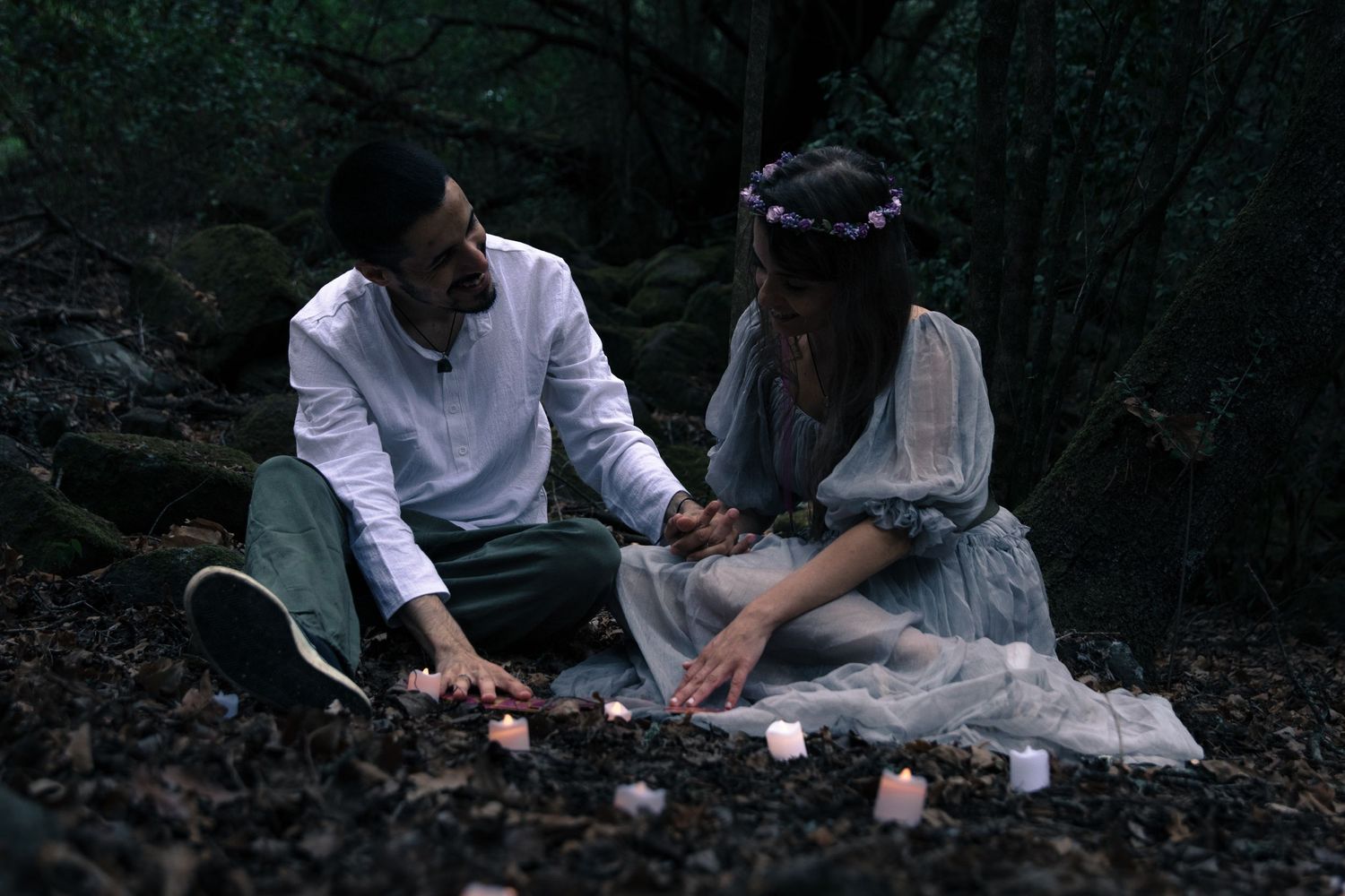 Moody forest photoshoot with soft lighting and natural scenery.