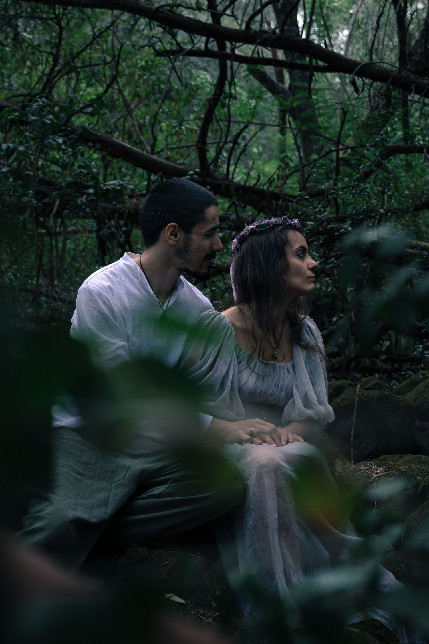 Romantic woodland photo session with dreamy lighting and lush greenery.