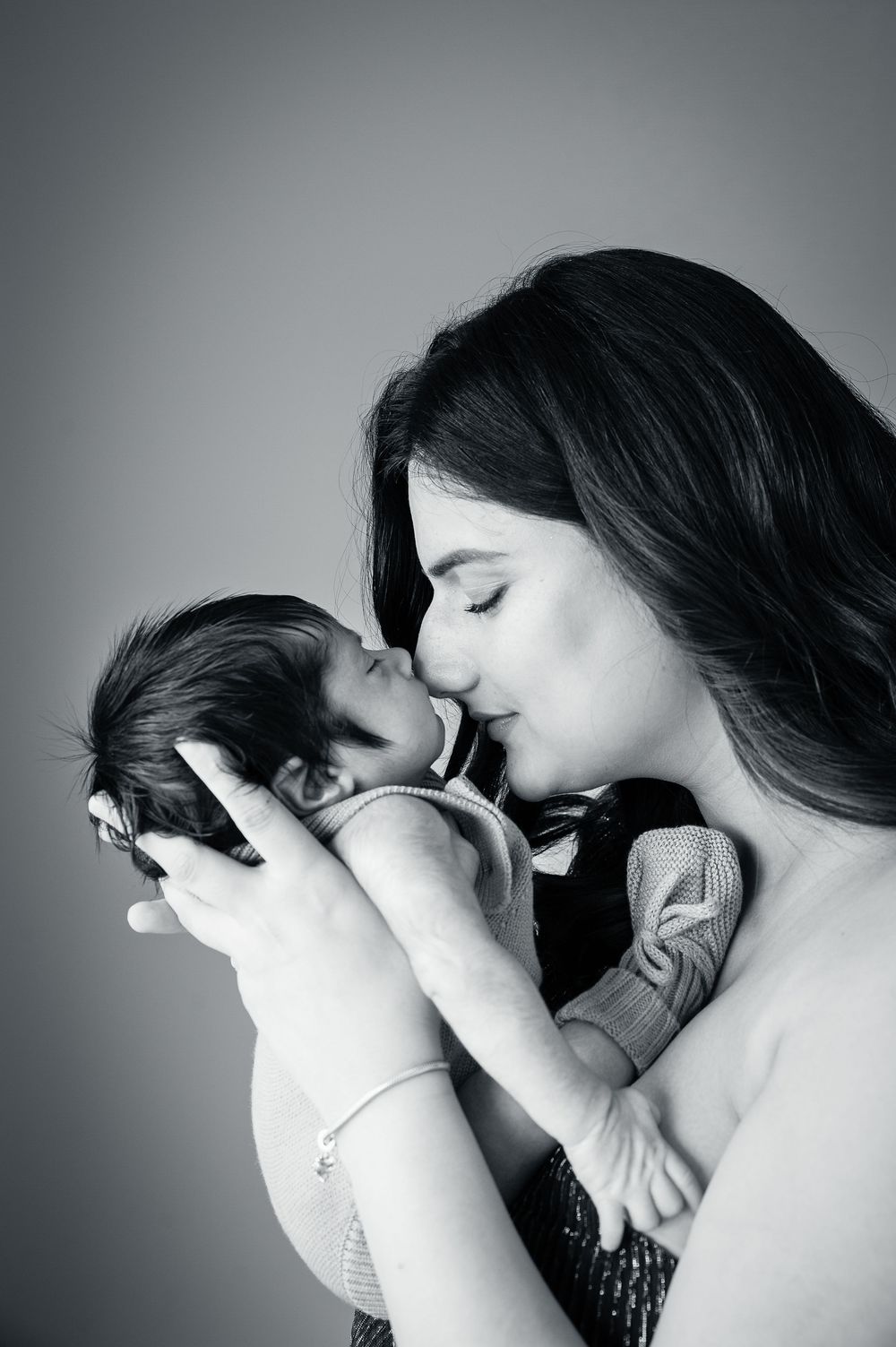 A tender moment is captured in black and white through a sequence of intimate photographs showing a mothers love.
Altona Family Photographer