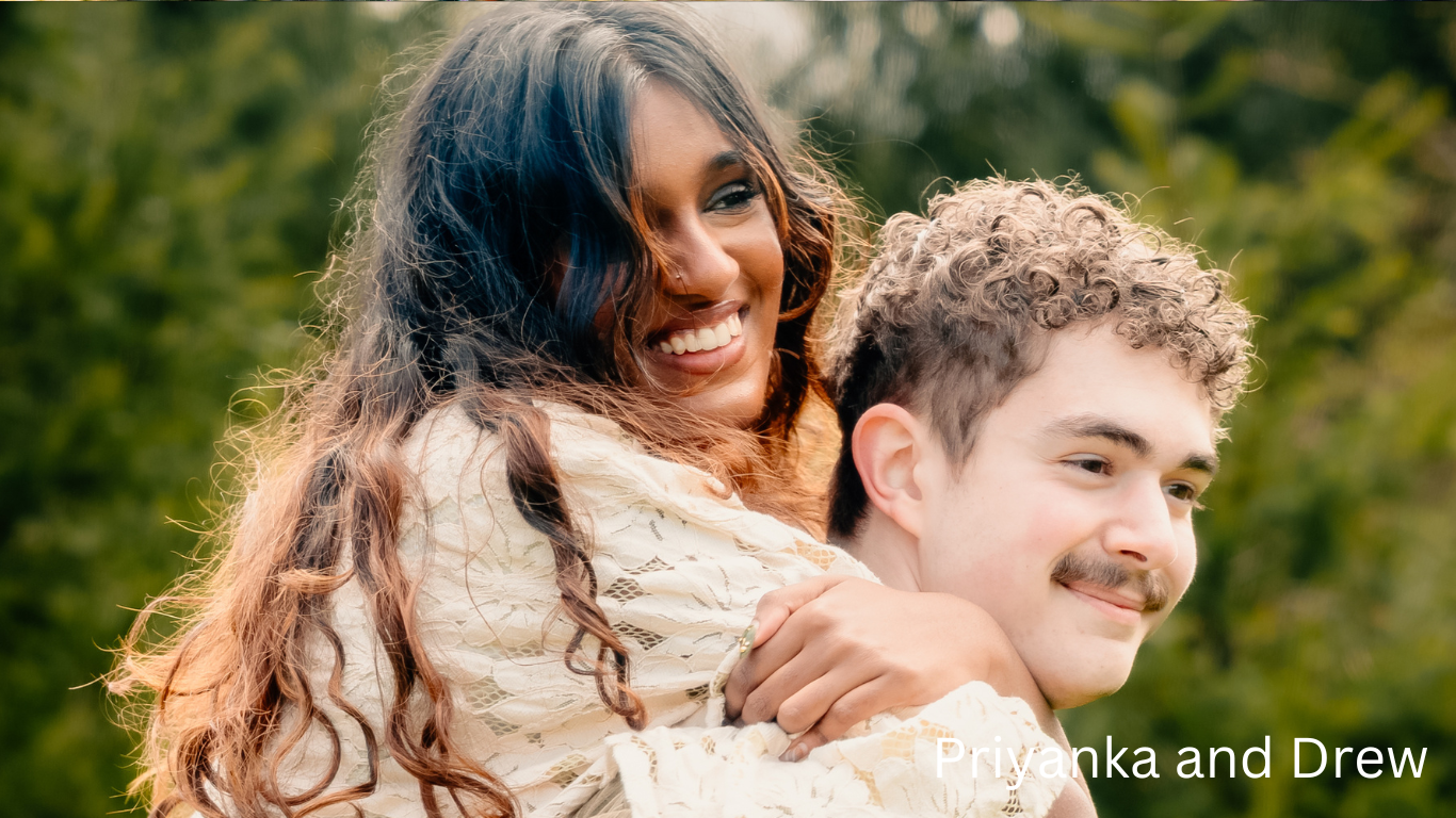 Couple sharing a joyful embrace outdoors with natural lighting.