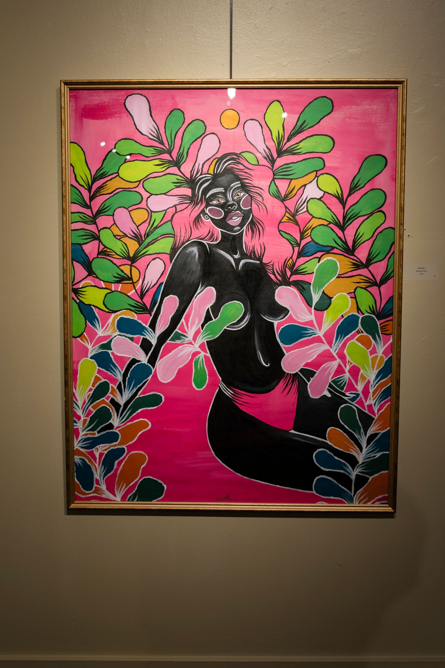 Vibrant pink artwork depicting figure surrounded by colorful botanical elements in decorative frame.