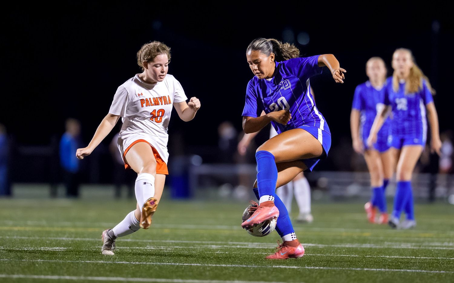 High school girls soccer game day action dribbling at night, Central PA, by Deanna Fox, SportsFox Photography, Hershey PA