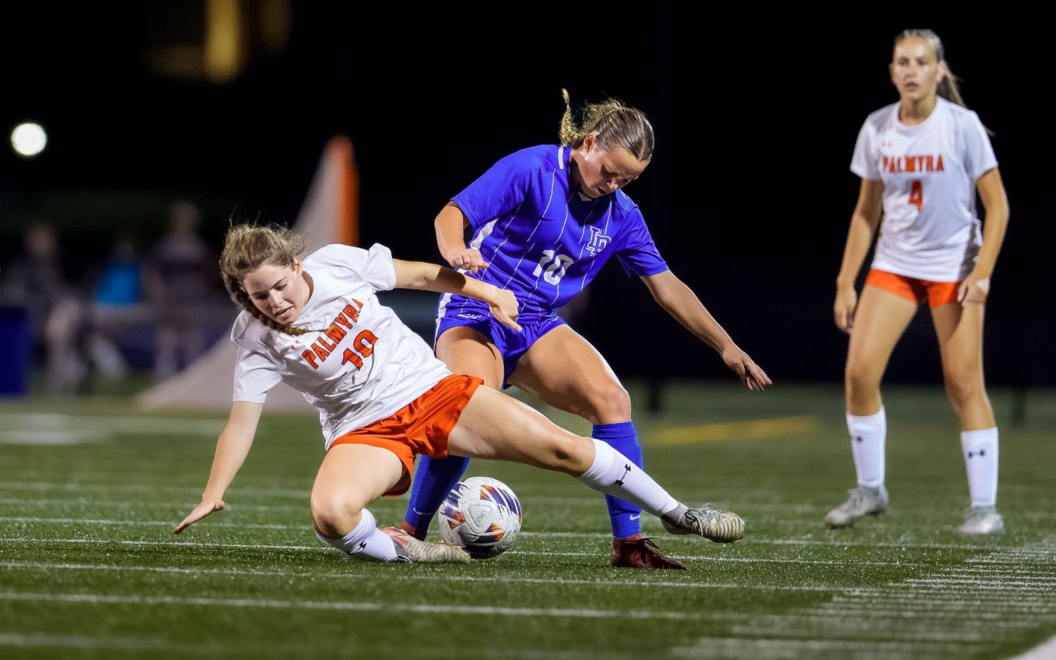 High school girls soccer sliding tackle game day action, Central PA, by Deanna Fox, SportsFox Photography, Hershey PA