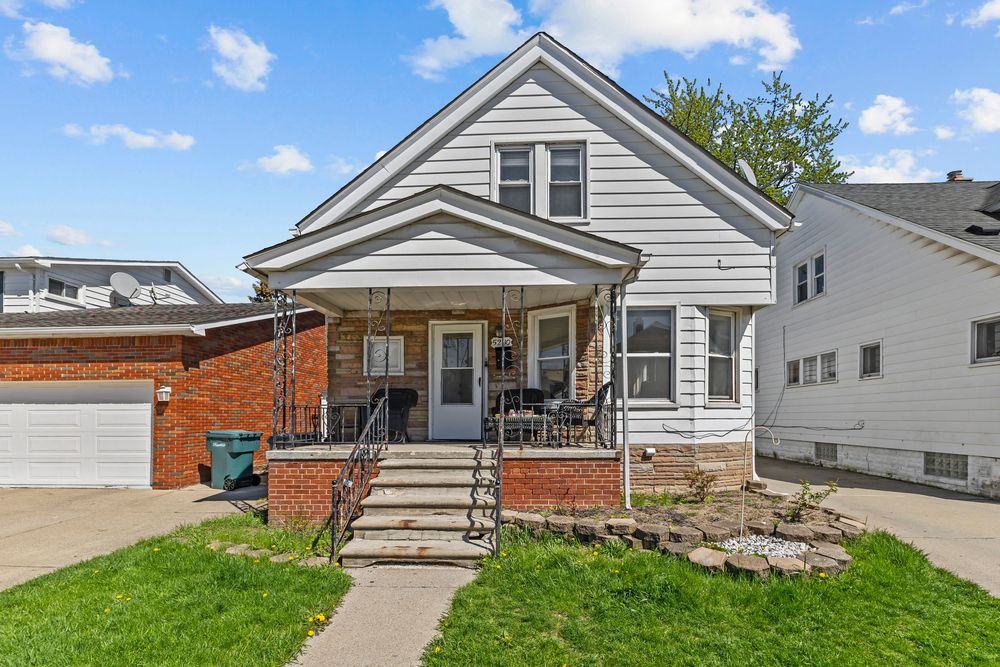 Front exterior of bungalow with covered porch on Williamson Street Dearborn Michigan