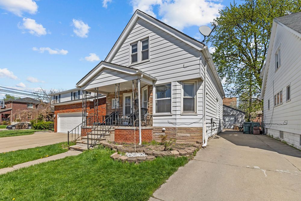 Front exterior of bungalow with covered porch on Williamson Street Dearborn Michigan