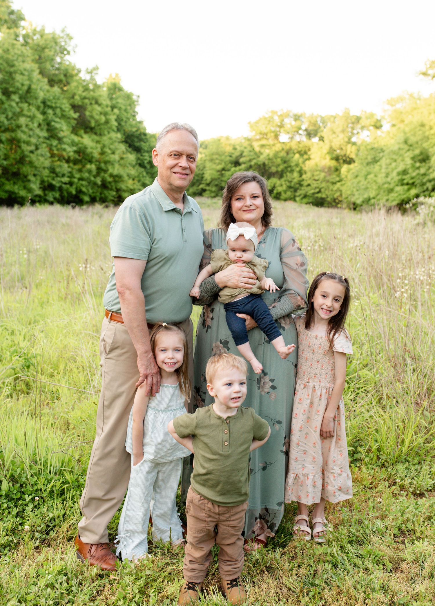 Grandparents holding grandchildren during family photos in O’Fallon Missouri