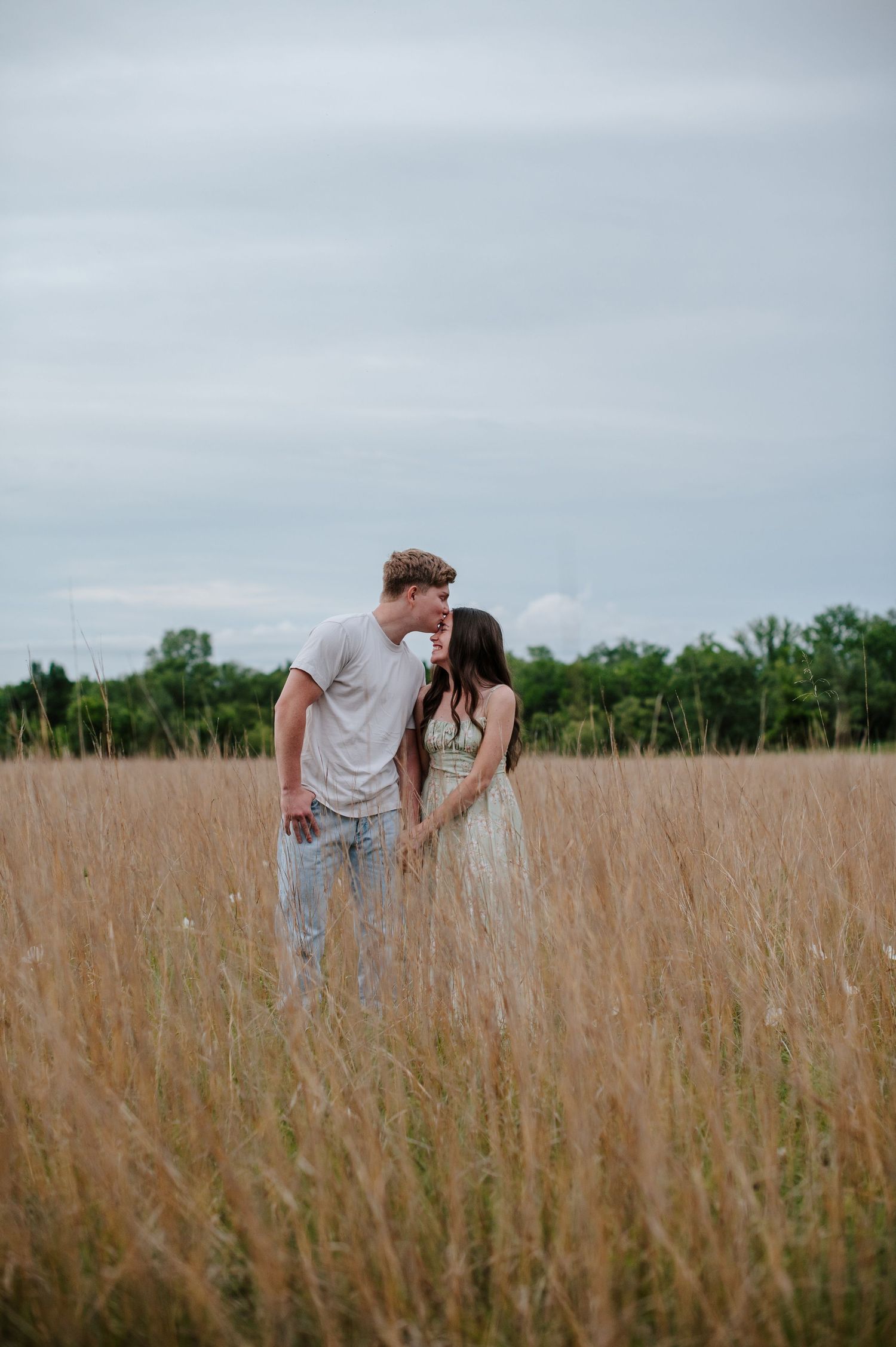 Wichita KS outdoor engagement photos in nature location Andover, couple photos in field with flowers, small elopement wedding photographer