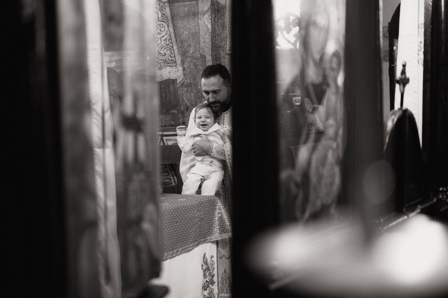 A black and white photo strip showing candid moments through window reflections and shadows.