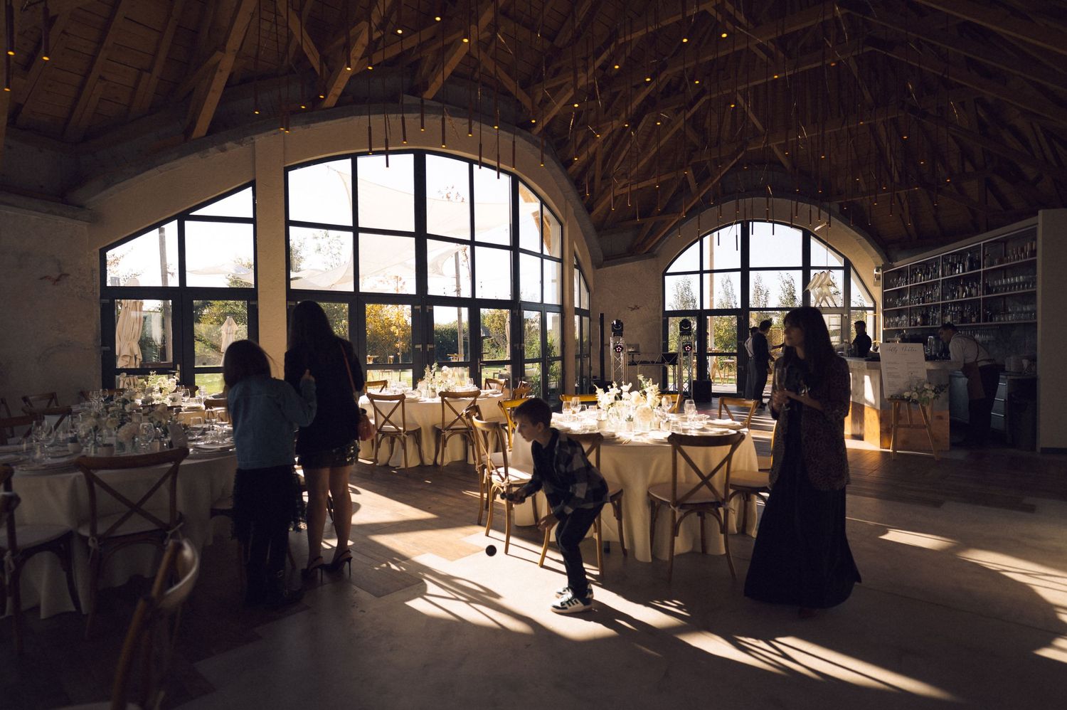 A series of panoramic shots showing a rustic barn interior with dramatic sunlight streaming through windows.