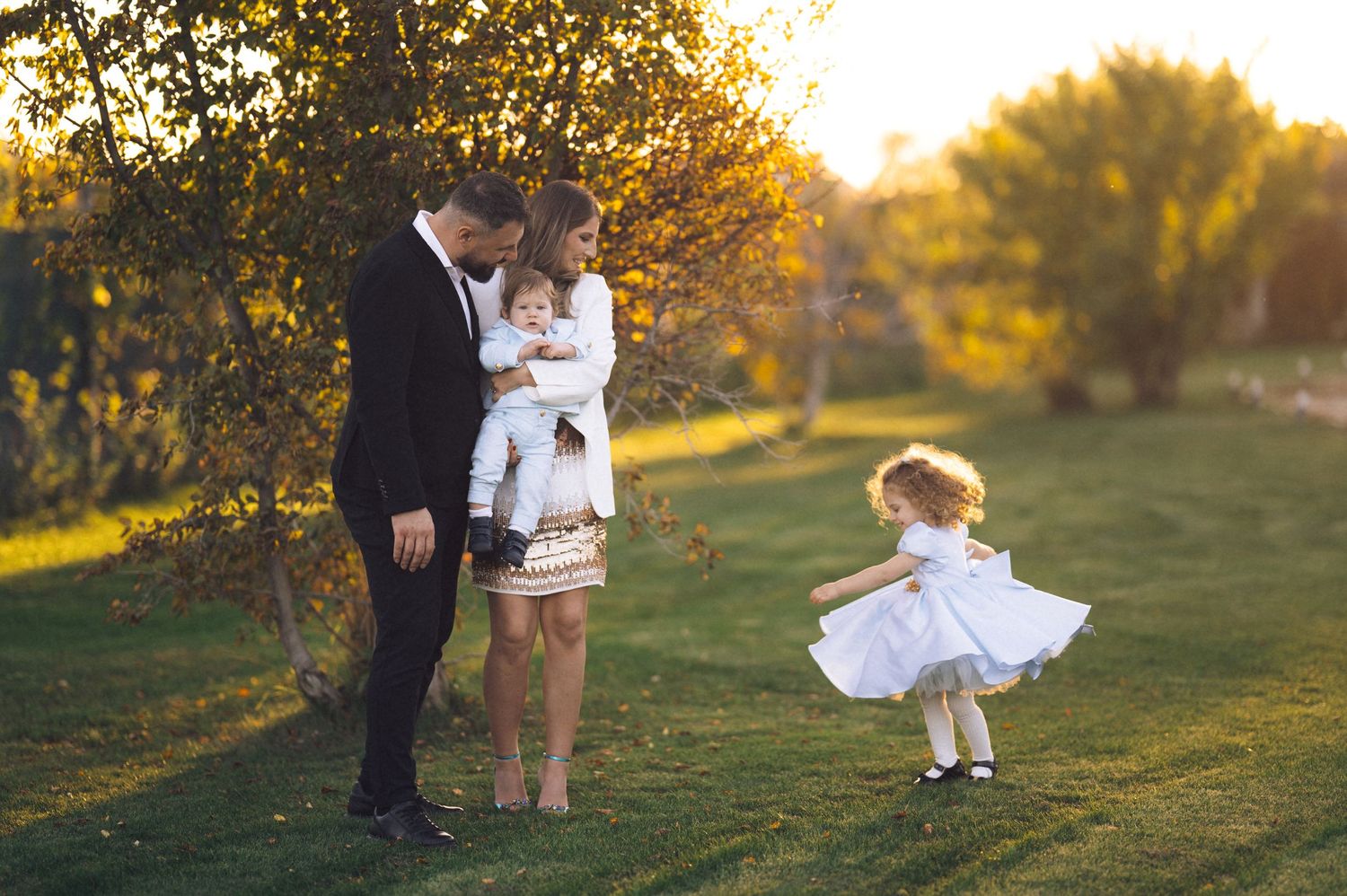 A series of romantic sunset photos showing a couple embracing in a grassy field with golden light filtering through trees.