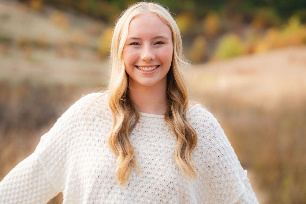 A series of professional outdoor portrait photos showing a person in a white sweater against a natural autumn background.