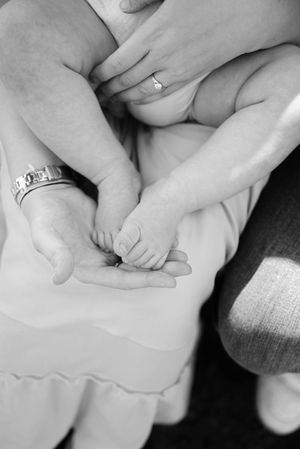 Black and white close-up photo series showing hands performing reflexology massage techniques on feet.