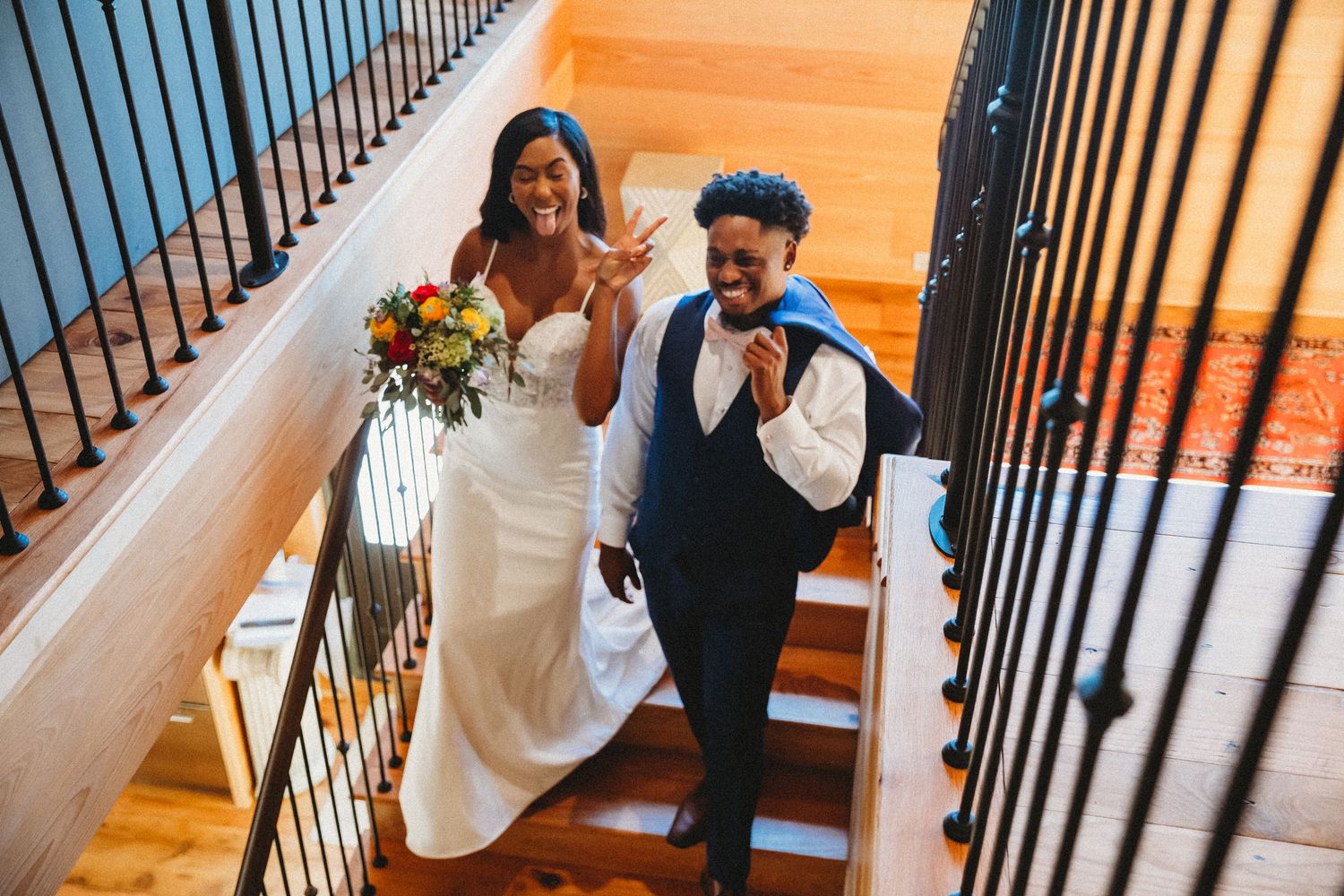 A sequence of joyful moments captured on a staircase with warm wooden tones and elegant wedding attire.
